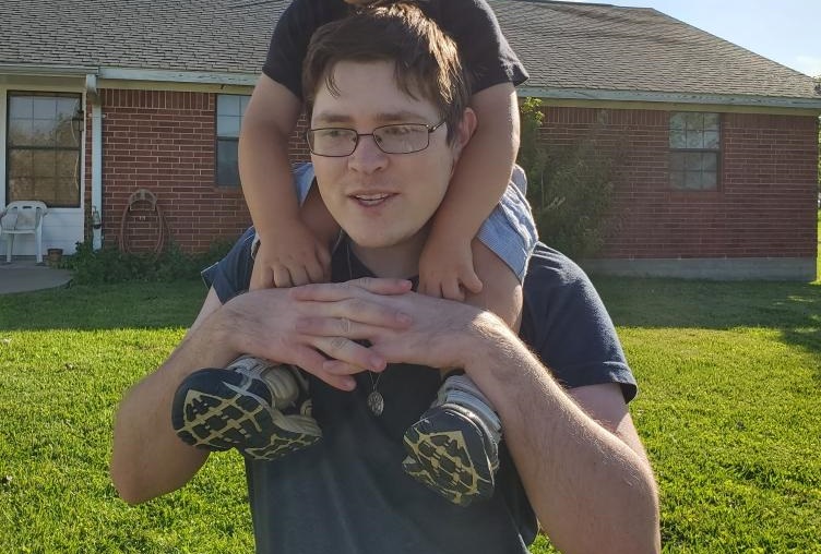 Adam Pavlicek, With his nephew, on his shoulders.